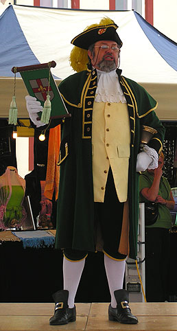 Town crier reads the news