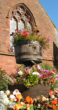 barrels as planeters in front of arched window