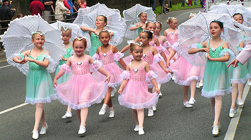 Pretty Parasol Dancers if the Procession