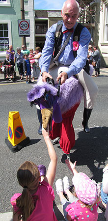 Man riding purple bird