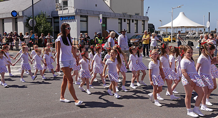 dancers in polka dots on Strand Street