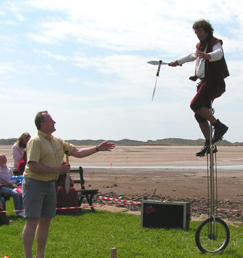 Unicycling whilst juggling knives