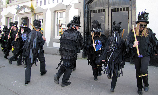 Black faced morris dancers on Main Street