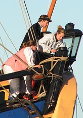Eighteenth century crew tying off the ropes