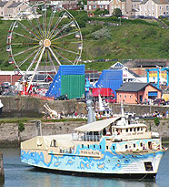 Fitz Caraldo theatre ship in fron of Ferris wheel