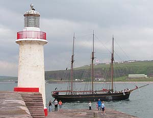 Tall ship Kathleen and May passing the West Pier lighthouse