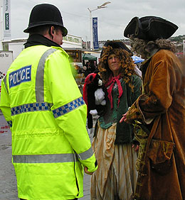 Policeman chats to character couple