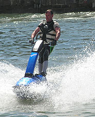 Standing high on the jet ski