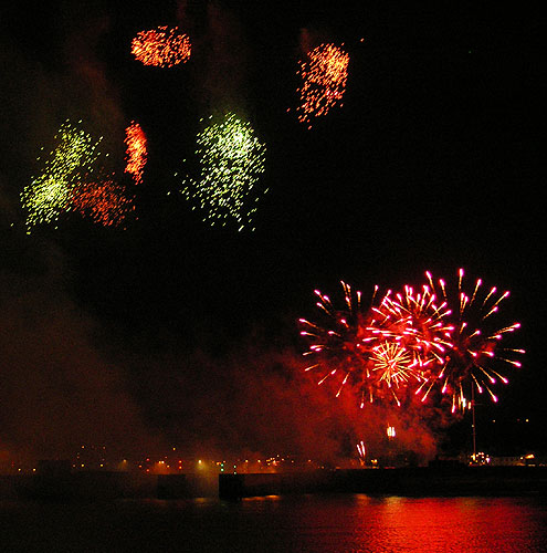 Clusters of fireworks in the  night sky