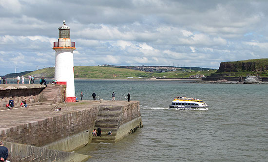 second World Tender passes the West Pier Lighthouse