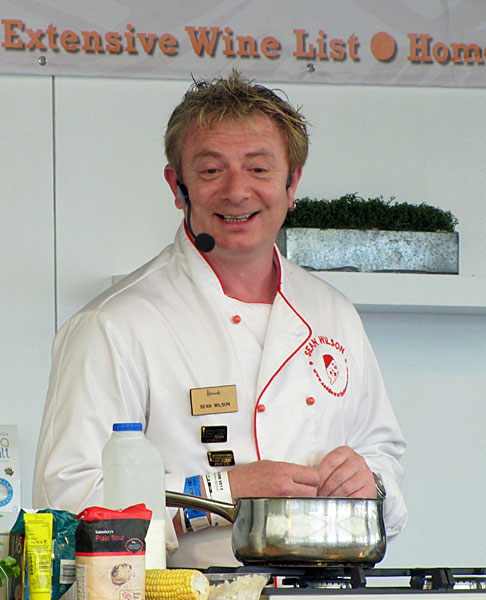 Sean Wilson on stage cheese cookery