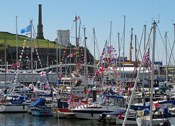 Whitehaven Marina yachts with flags