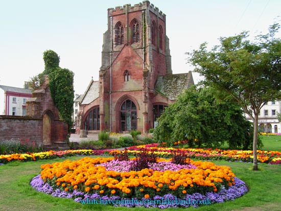 St. Nicholas church tower with circular flower bed