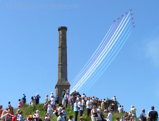 Red Arrows fly past the candlestick chimney